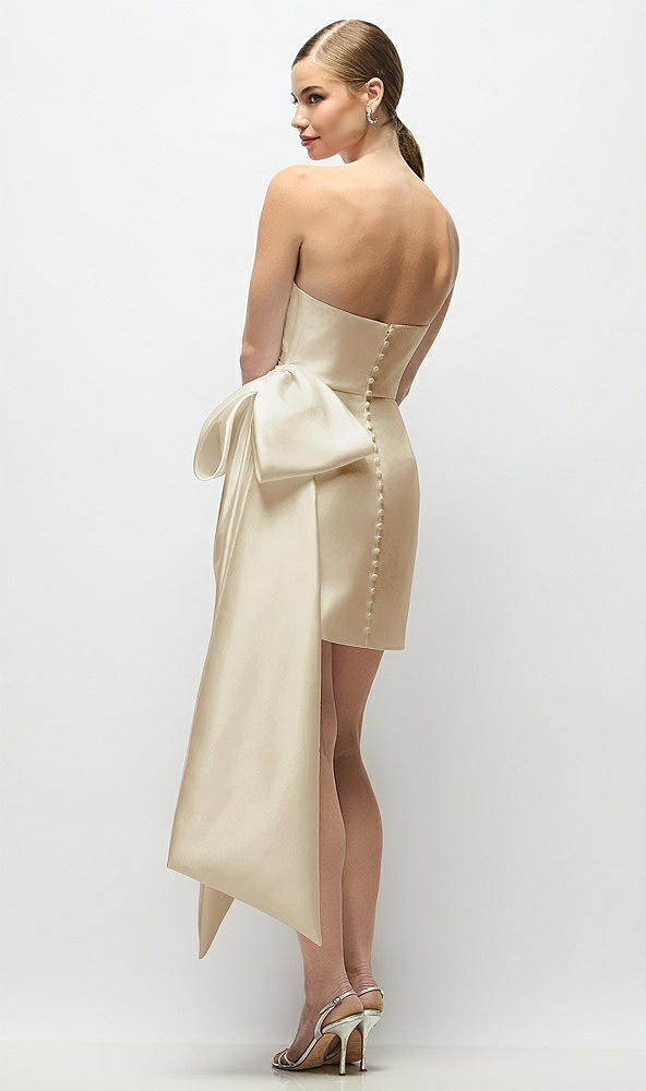 Back View - Champagne Strapless Pleated Draped Satin Mini Dress with Dramatic Long Tail Bow & Covered Buttons