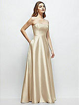 Side View Thumbnail - Champagne Strapless Satin Gown with Full Skirt and Covered Buttons at Back