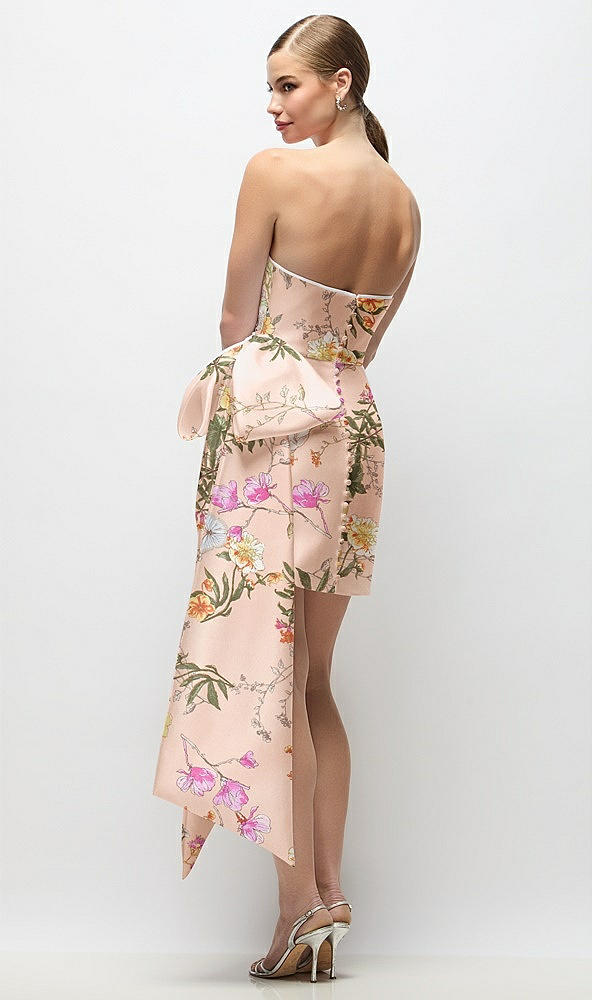 Back View - Butterfly Botanica Pink Sand Strapless Pleated Draped Floral Satin Mini Dress with Dramatic Long Tail Bow & Covered Buttons